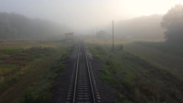 Traffic on the Railway Tracks Morning Autumn Fog the Sun Shining Through the Fog on the Road