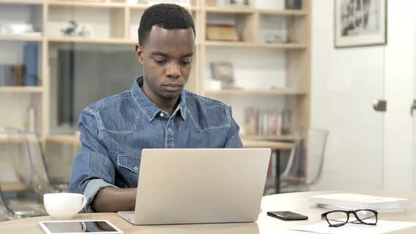 African Man Working On Laptop