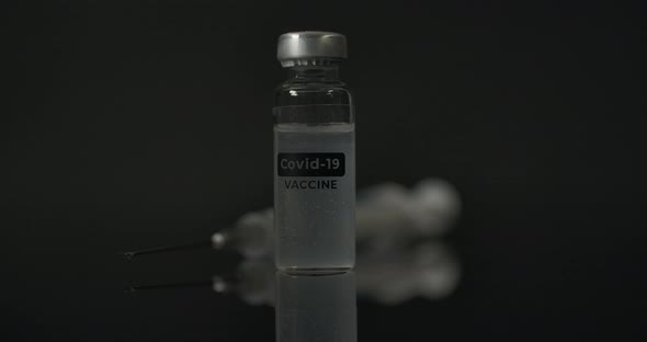 Covid 19 Vaccine Injection On The Reflecting Surface