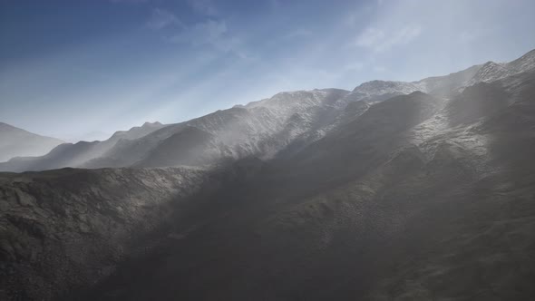 Sun Rays Against the Backdrop of the Mountains