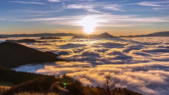 Peaceful Sunny evening in Mmountains Nature with Foggy Clouds Flows at Autumn Sunset Lanscape