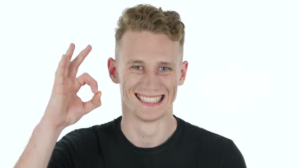 Okay Sign By Young Man on White Background