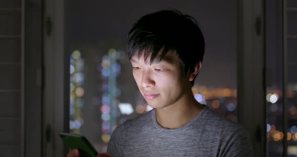 Man use of smart phone at home