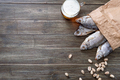 Salted dried fish in a paper bag, fresh beer, pistachios - PhotoDune Item for Sale