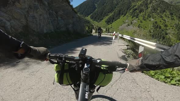 Cyclist Ride Bicycle at Mountain Road