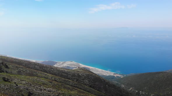 Aerial View From Llogara Pass to Albanian Riviera Beach Clouds and Ionian Sea Coastline