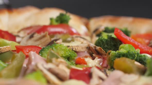 Close Up of a Slice of Pizza with Mushrooms Cheese Broccoli Pepper