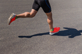 legs male runner athlete run on asphalt road - PhotoDune Item for Sale