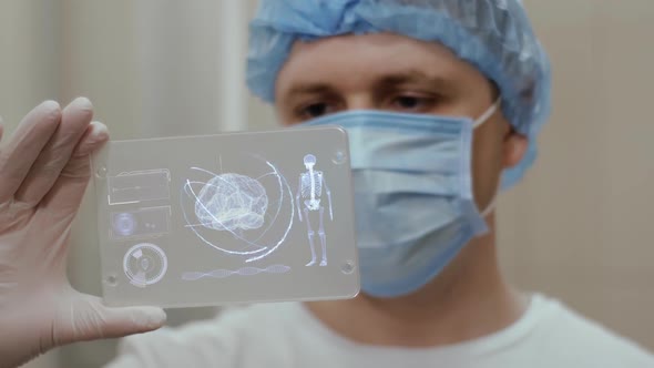 Doctor with Futuristic Hologram Hud Screen Tablet
