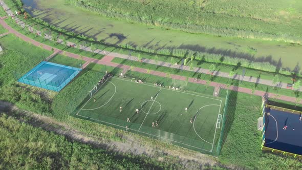 Football Soccer Field with people playing soccer and football