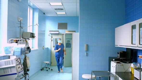 Doctor and nurse running in passageway of hospital