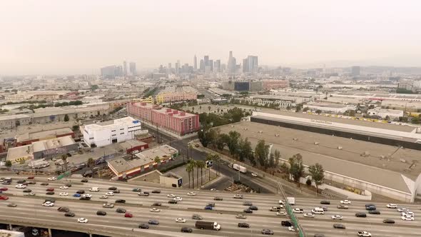 Aerial View with Downtown LA from near 10 Freeway Moving Cars Gloomy Day Pandemic Covid-19