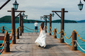 honeymoon couple walk on pier - PhotoDune Item for Sale