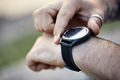 Close-up of man checking smartwatch - PhotoDune Item for Sale