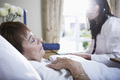 Senior woman lying in hospital bed - PhotoDune Item for Sale