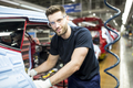 Portrait of confident man working in modern car factory - PhotoDune Item for Sale