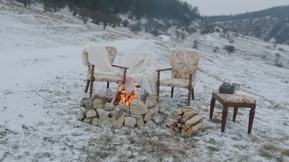 Fire on the Snow with the Comfortable Armchairs and Fluffy Beds for a Lovely Couple