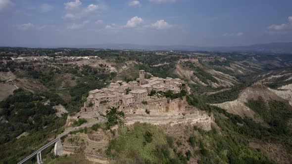 -SHOT: 180º bird's eye view-DESCRIPTION: video with drone over the civita di Bagnoregio, in the Ita