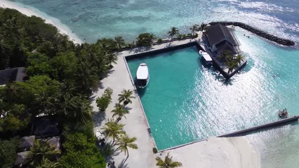 Aerial View of a Tropical Paradise Island Bay Covered in Limestone Trees with Crystal Clear Beach