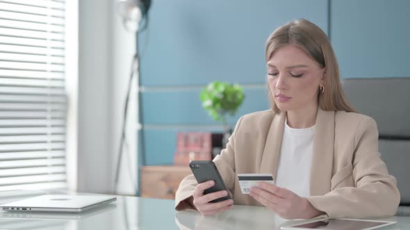 Businesswoman Shopping Online on Smartphone at Work