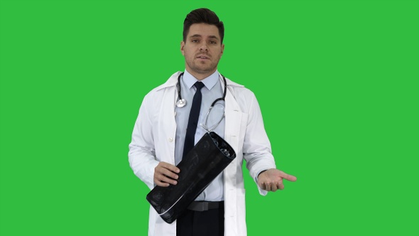 Doctor Telling X Rays Results to Camera on A Green Screen