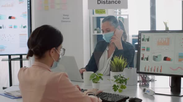 Bussines Woman with Face Mask Checking Financial Reports