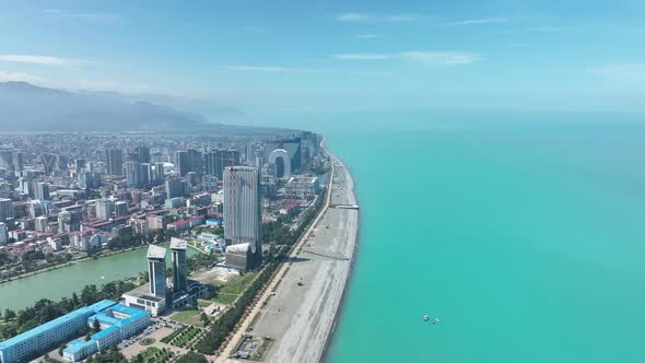 Aerial view of beautiful lake in the center of Batumi. flying over 6 May park. Georgia 2022 summer