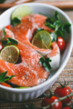 Fresh salmon steaks with lime, cherry tomatoes, parsley and olive oil - PhotoDune Item for Sale