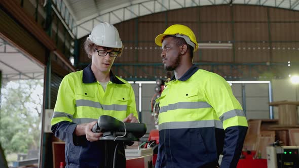 Diversity team of factory engineers ,leadership by engineer women are inspecting and consulting