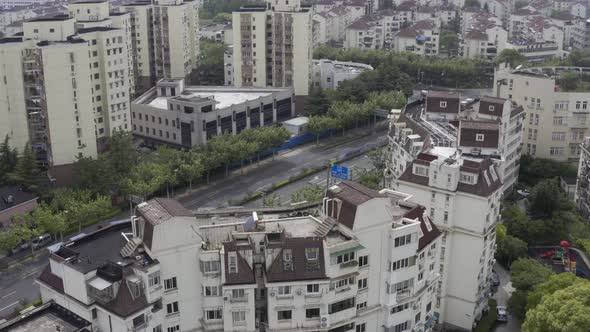 Aerial footage from shanghai during the pandemic lockdown 2022. Lonely car is passing on an empty st
