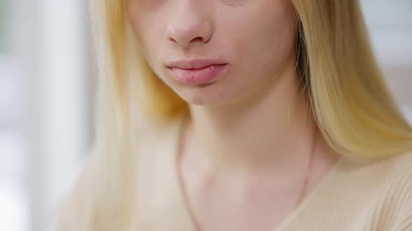 Closeup of Unrecognizable Young Woman Showing Hush Gesture Finger on Lips