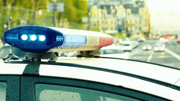 Flashing Flasher on the Roof of a Police Car. Blinker. Close-up.