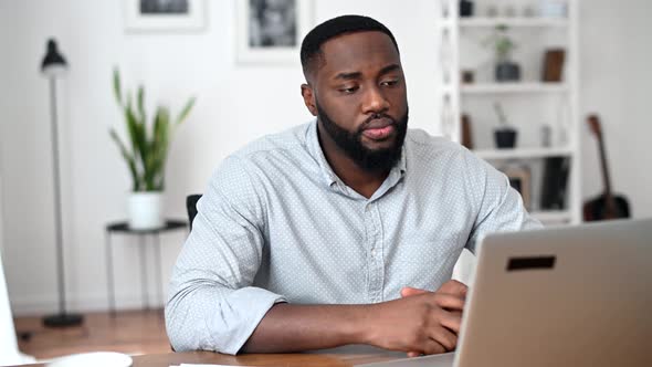 An African Guy Is Using Laptop for Video Call