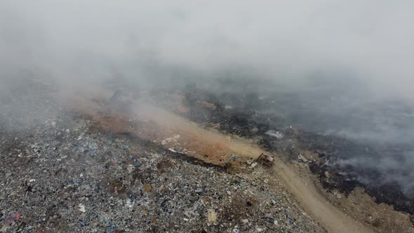 Fume is release due to burning at landfill site