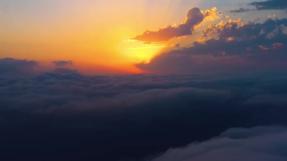 Flying Over the Clouds with the Late Sun