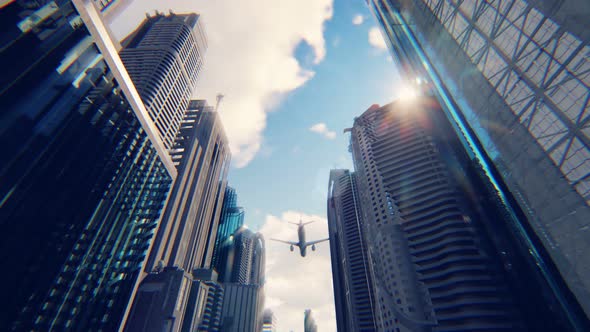 A passenger Plane Flies Over a Modern Megapolis
