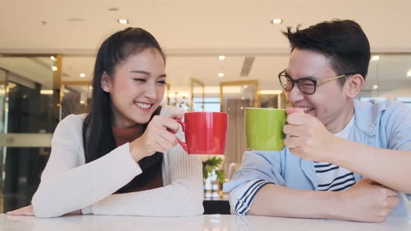 Happiness asian couple laugh smile together in kitchen pantry humor emotional casual relax with room