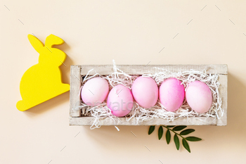  pink eggs on trendy pastel background. Top view flat lay. Copy space.