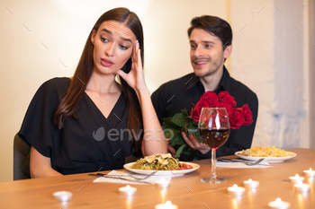 jecting excited emotional obsessed guy who offering her bunch of red roses. lady turning away. Friendzone And Blind Date Concept, Bad First Impression