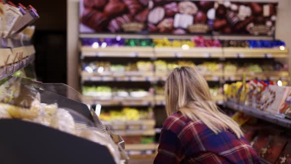 Female Staff in Mask Working at Bakery Section of Supermarket