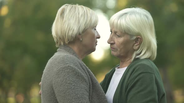 Mature Women Hugging to Support Each Other