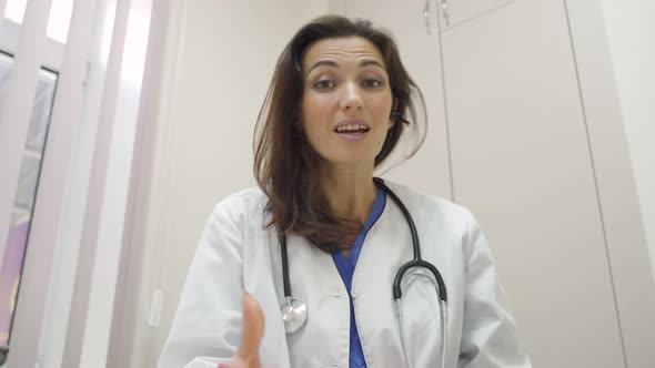 Attractive Female Doctor Wear Headset Make Online Video Call Consult Patient