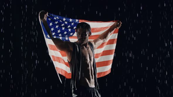 Victorious Man In The Rain With American Flag