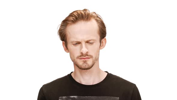 Sad Young Handsome Man Thinking Over White Background