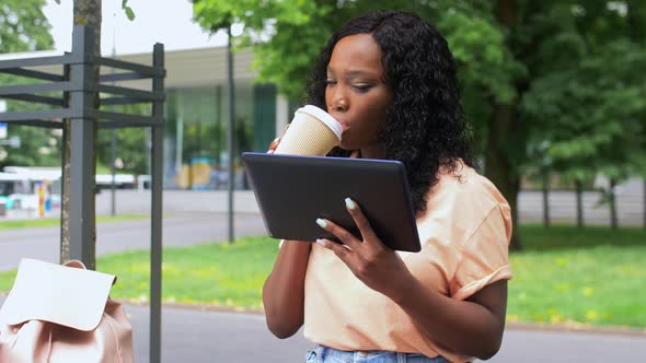 Student Girl with Tablet Pc and Drinking Coffee
