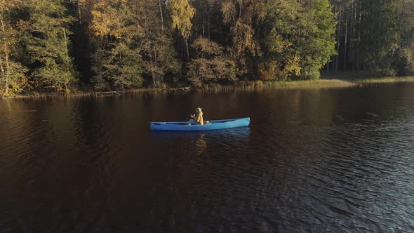 Woman Paddle a Canoe Aerial View