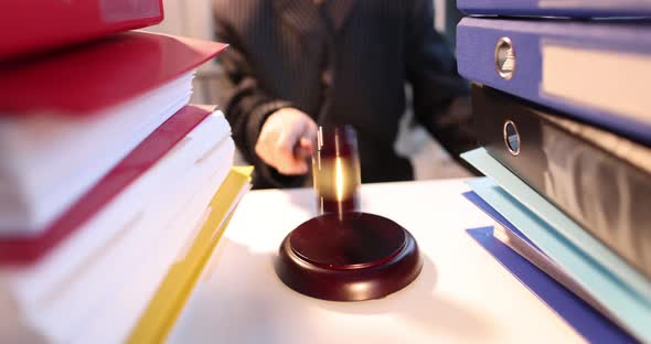 Judge Knocking with Gavel on Table with Folders of Papers Closeup  Movie