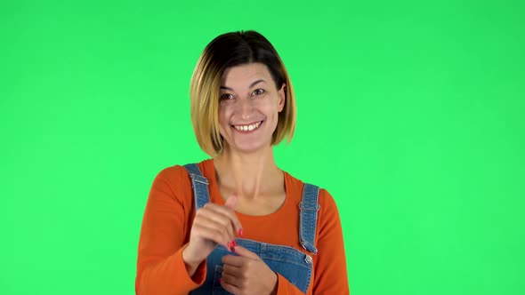 Happy Woman Waving Hand and Showing Gesture Come Here. Green Screen