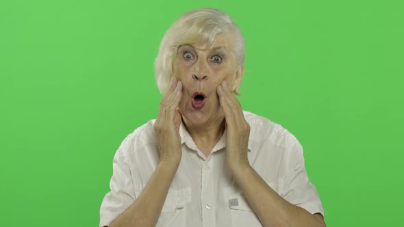 An Elderly Woman Shows Amazement, Surprise, Joy and Smiles. Chroma Key