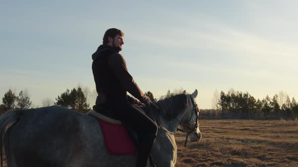 A Man Rides a Horse Closeup